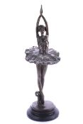A contemporary bronze figure of ballerina. On a black marble plinth.