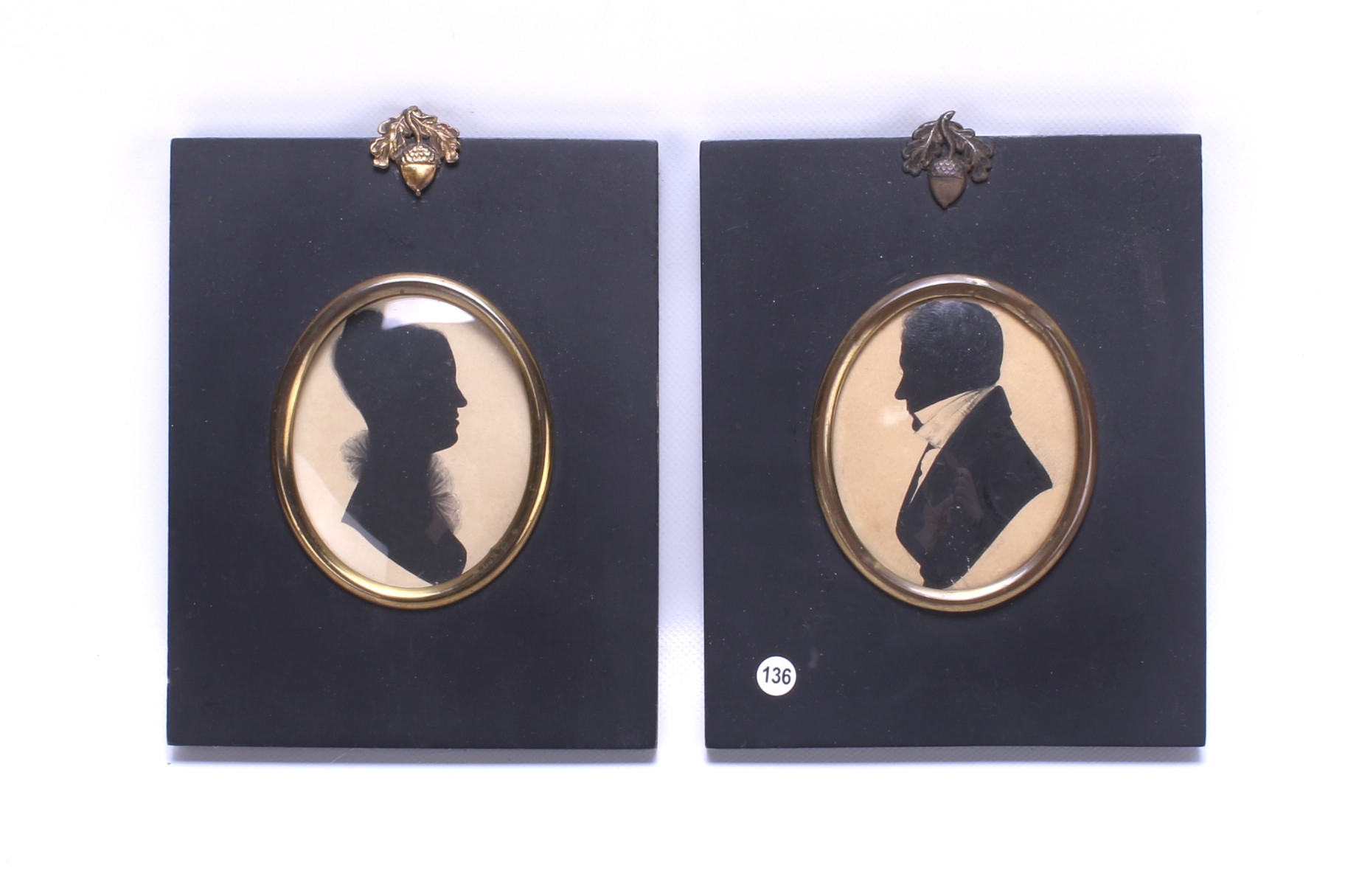A pair of 19th century portrait silhouettes.