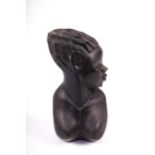 A carved ebonised wooden African bust of a female. H25.