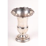 An Edwardian silver vase. Marked Birmingham 1902, with a fluted rim and circular base, H13.