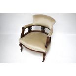 An Edwardian elbow chair.