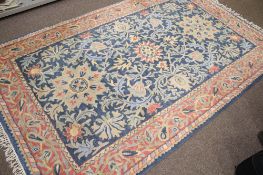A 20th century woollen rug.