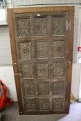 An oak livery cupboard having earlier carved panel door.