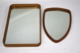 Two mid-century wooden framed mirrors. One of rectangular form, 70.
