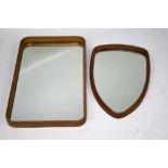 Two mid-century wooden framed mirrors. One of rectangular form, 70.