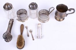 A collection of assorted vintage silver plated items. Including small tankard, tongs, etc.