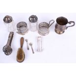 A collection of assorted vintage silver plated items. Including small tankard, tongs, etc.