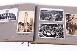 A vintage photograph album containing postcards and photographs from the 'English Historical