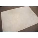 A contemporary cream rug.