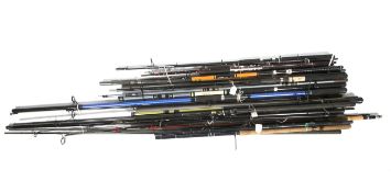 A collection of fifteen sea, fly and coarse fishing rods.