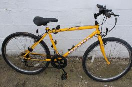 An Apollo Forma child's mountain bike. With an 18" yellow frame.