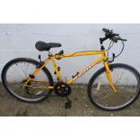 An Apollo Forma child's mountain bike. With an 18" yellow frame.