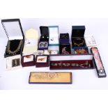 A collection of twenty boxes of assorted costume jewellery.