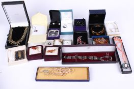 A collection of twenty boxes of assorted costume jewellery.