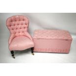 A contemporary button back nursing chair and window seat. Both upholstered in pink floral fabric.