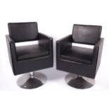 Vintage / Retro : A pair of Dir salon black leather swivel chairs. On a chrome circular base.