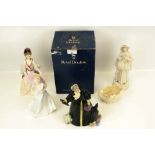 A collection of assorted figurines of ladies.