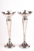 A pair of vintage silver weighted bud vases.