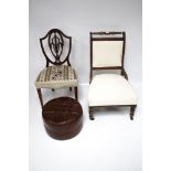 Two early 20th century chairs and a contemporary footstool.