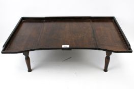 A British mahogany metamorphic side table. Three sections, H25cm x W68.5cm x D40.