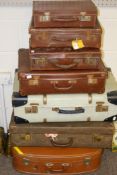 A collection of seven assorted vintage suitcases. Max.