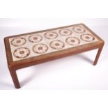 Vintage / Retro : A G-Plan red teak and tile top table, H39.5cm x W111.6cm x D51.