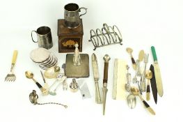 An assortment of silverplated items. Including a cigarette case, cutlery and cups, etc.