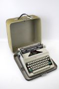 An Olympia portable manual typewriter.