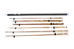 A collection of split cane fly, spinning and coarse fishing rods.