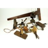 A collection of assorted vintage hand tools. Including drills, planes, chisels, an oil lamp, etc.