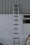 An Abru Starmaster DIY 3.5m two-section aluminium ladder.