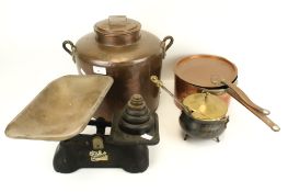 An assortment of metalware. Including a set of scales, a copper saucepan, twin handled pot, etc.