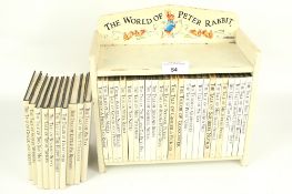 A Beatrix Potter book collection in a stand.