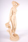 Vintage / Retro : A Kitsch cast cream coloured resin figure of a lady standing next to a wave. H47.
