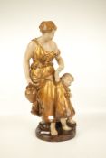 A vintage Austrian ceramic group of women and child. Stamped #637.
