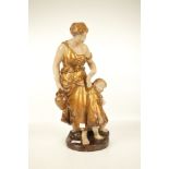 A vintage Austrian ceramic group of women and child. Stamped #637.