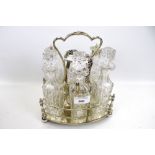 A silver plated six piece cruet stand set and four oblong salts