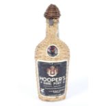 A vintage bottle of Hooper's Rare Port. In wicker case, no volume shown but weighing 1.39kg.