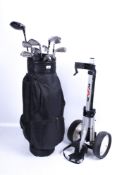 A contemporary golf bag and assortment of clubs.