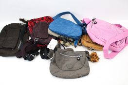 A collection of eight assorted Kipling womens' handbags.