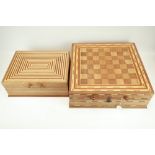 Two similar marquetry handmade games storage boxes.