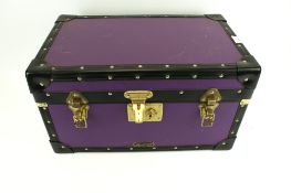 A small contemporary travelling trunk.