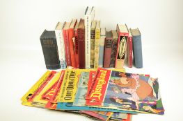 A collection of assorted vintage books and comics.