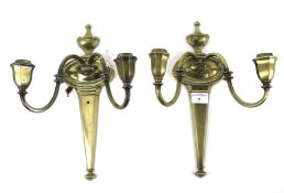 A pair of Georgian style two branch brass wall lights.