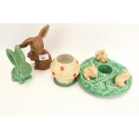 A collection of three assorted Sylvac pottery rabbits.
