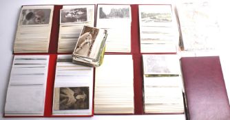 A collection of assorted early 20th century postcards.