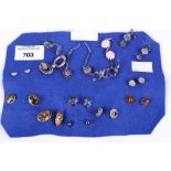 A collection of fourteen assorted pairs of ladies silver earrings. For pierced ears.