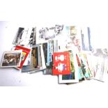 A collection of assorted picture postcards. Including a photo album and some loose.