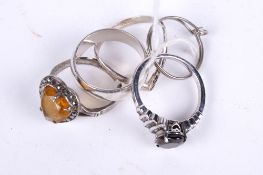 Five assorted silver rings. Including a heart shaped citrine set dress ring, gross weight 14.