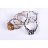 Five assorted silver rings. Including a heart shaped citrine set dress ring, gross weight 14.